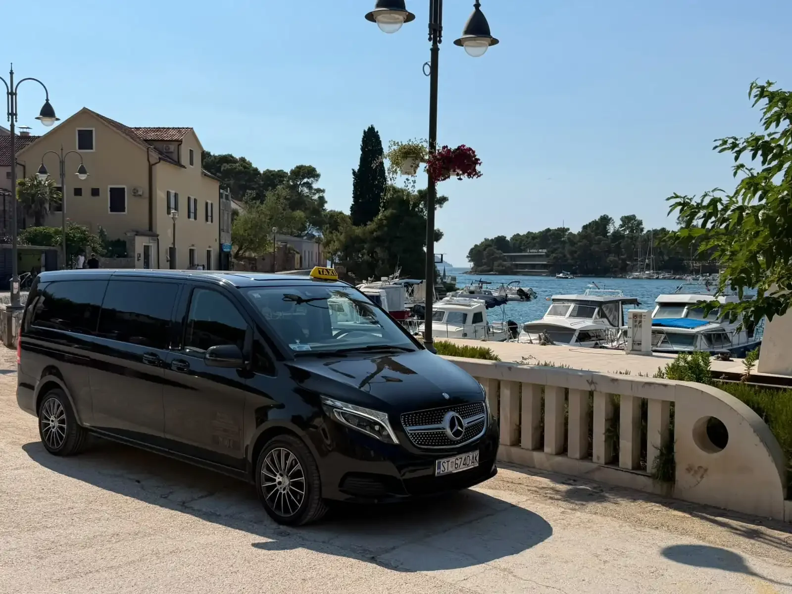 Black Mercedes taxi van in Hvar harbour